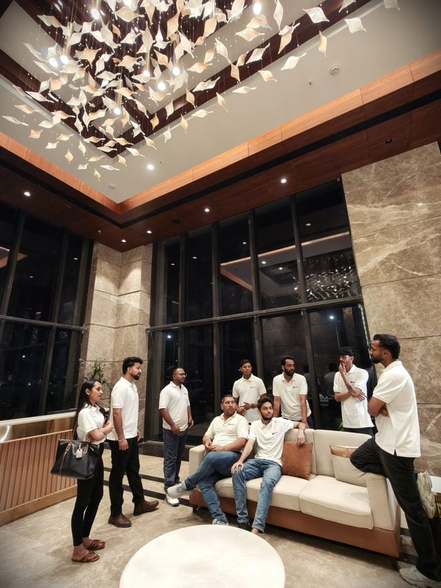 Swyft customer support team together in the office lobby