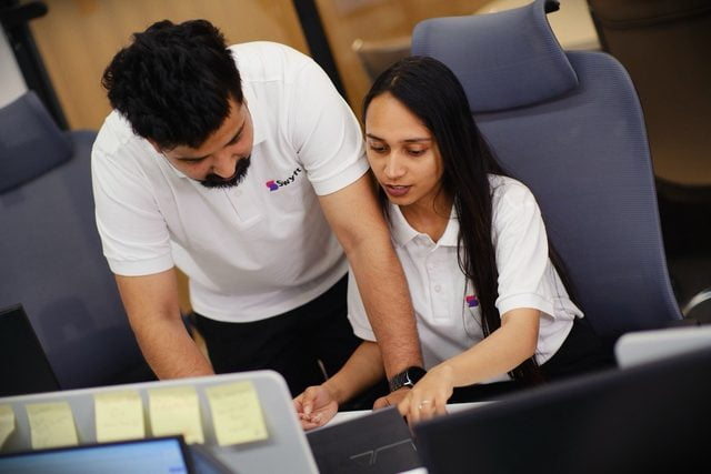 Swyft analytics team reviewing data together
