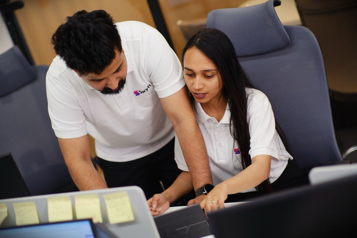 Swyft analytics team reviewing data together